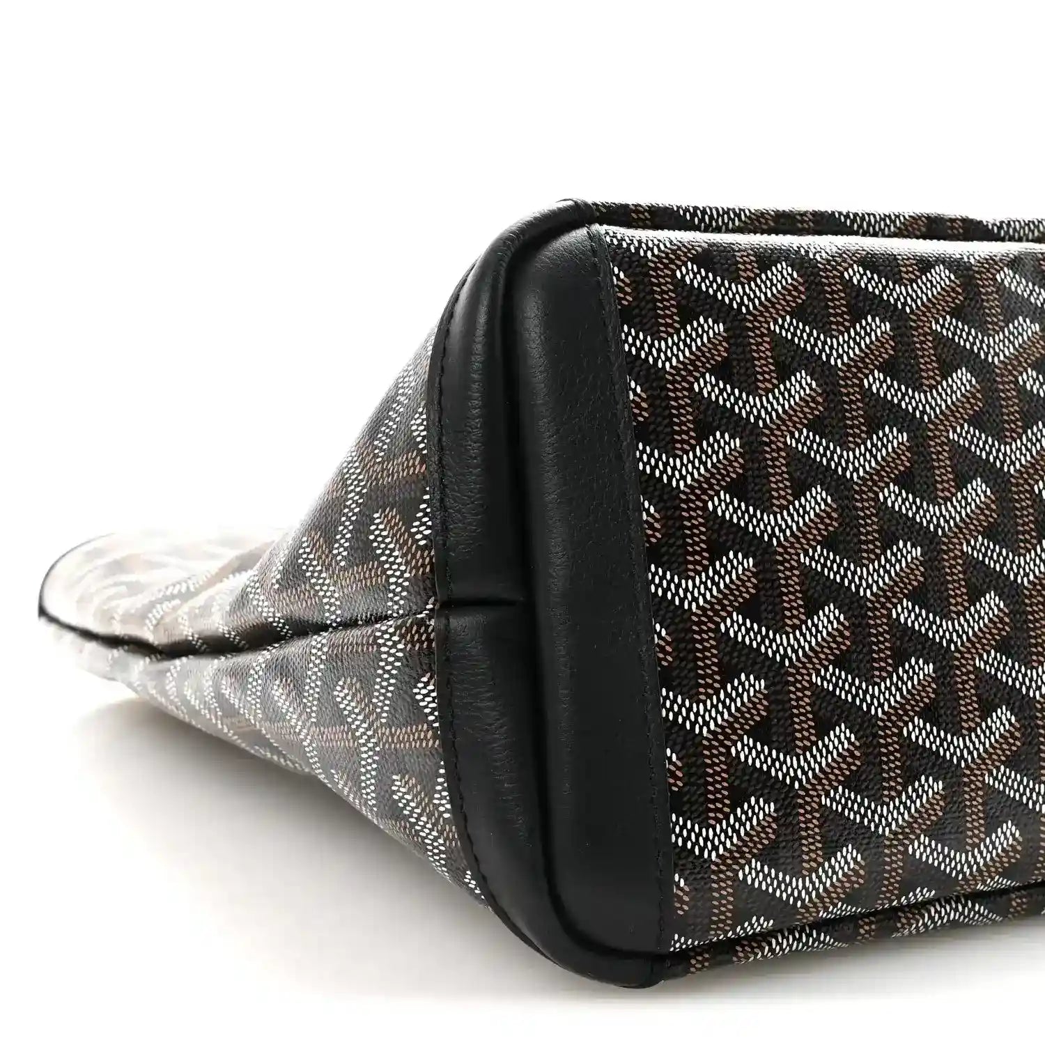 Goyardine tote bag side with black leather corner trim.