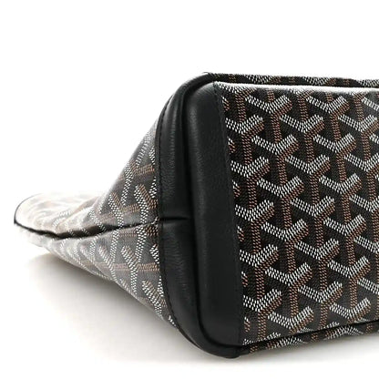 Goyardine tote bag side with black leather corner trim.