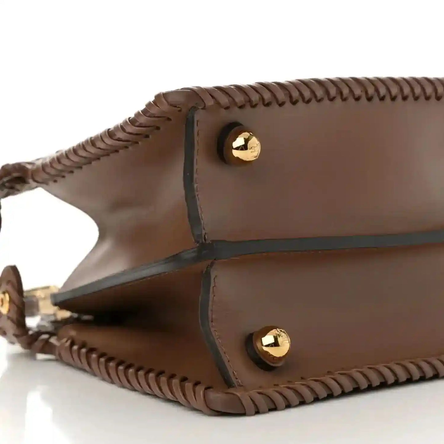 Brown leather satchel base with two gold snap buttons and woven trim