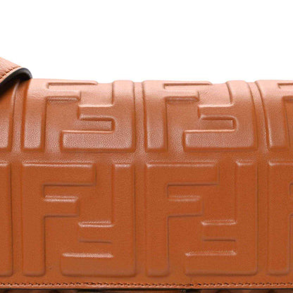 Fendi baguette bag close-up of tan embossed geometric pattern and edge stitching
