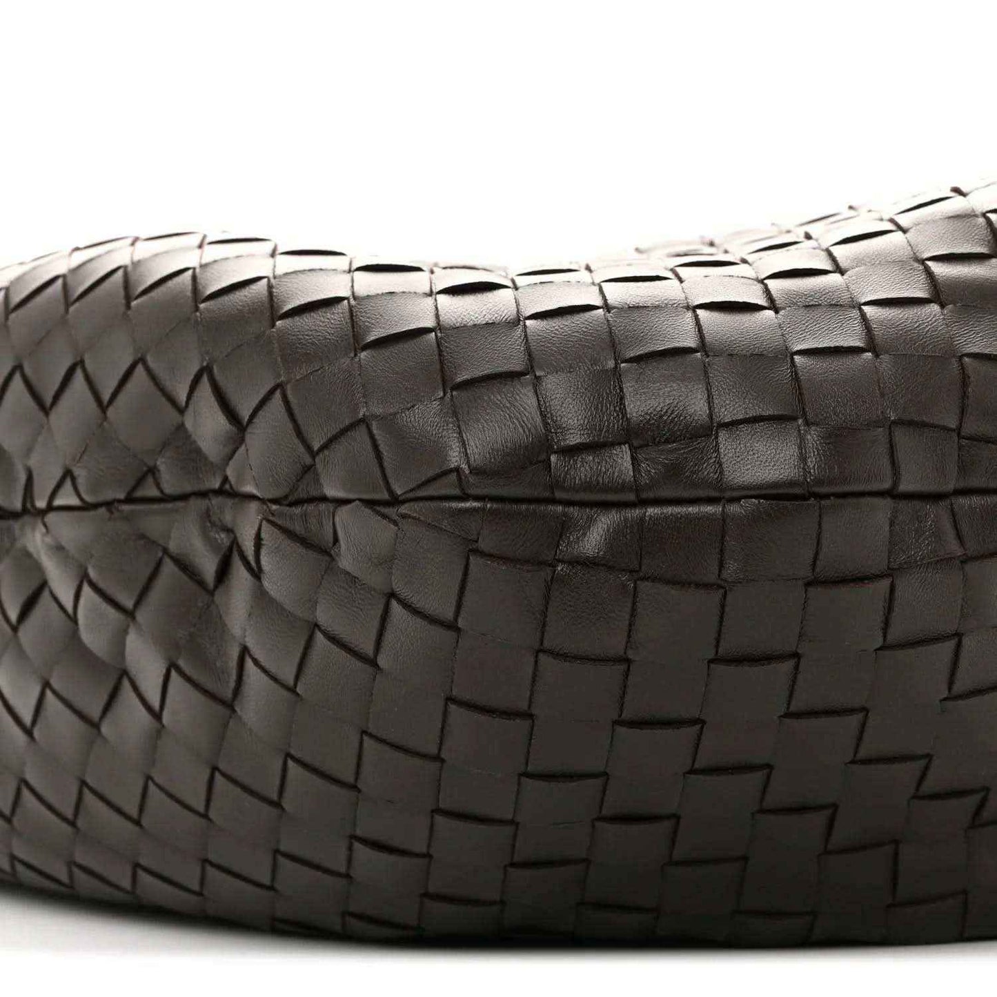 Close-up of intrecciato leather weave on the bag with stitched border detail