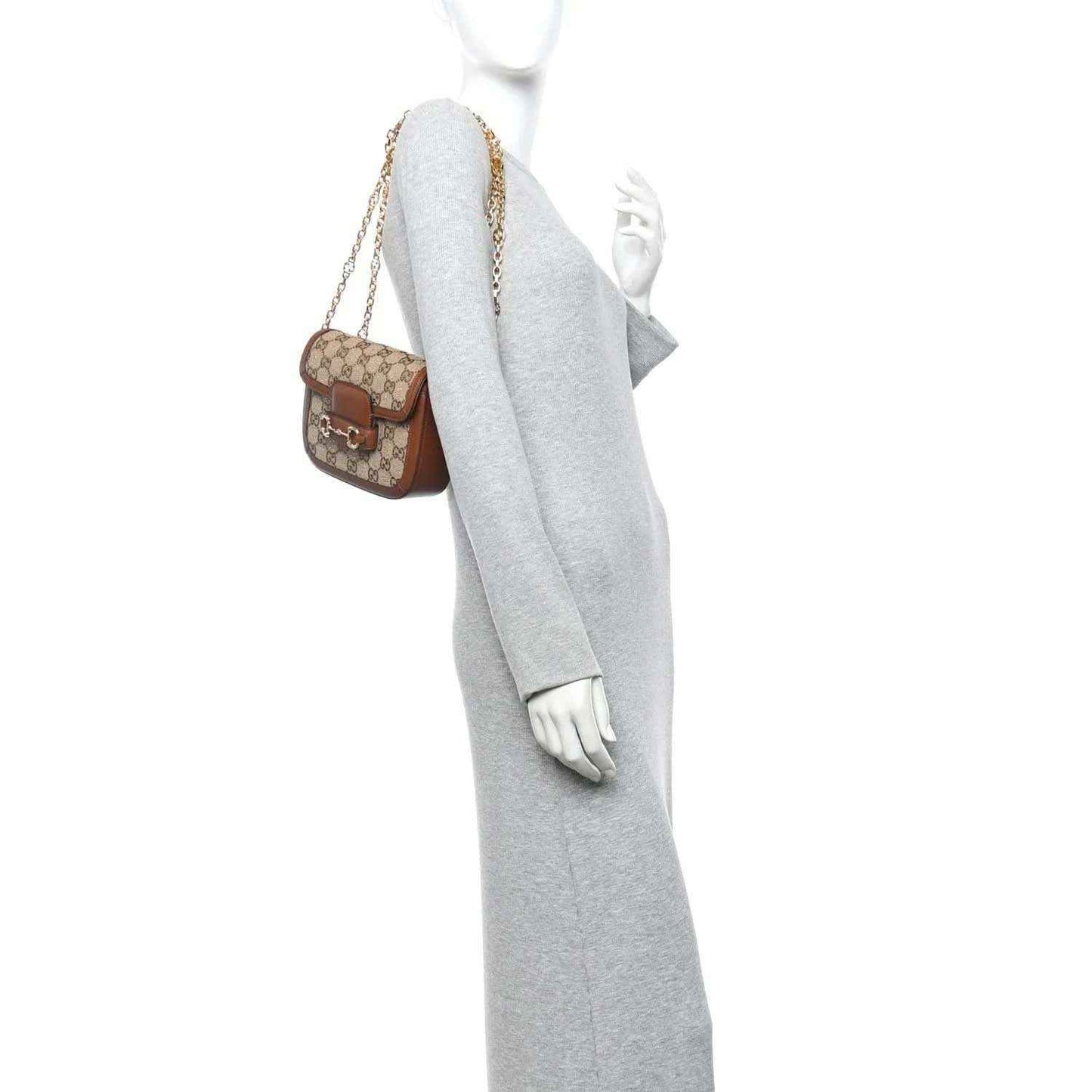 Mini shoulder bag on a person: GG monogram canvas with brown leather trim and chain