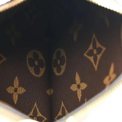 Monogram fabric panel with repeating floral and star motifs, dark fango