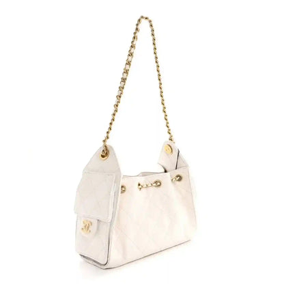 White quilted mini handbag with gold chain strap and gold front CC-style charm