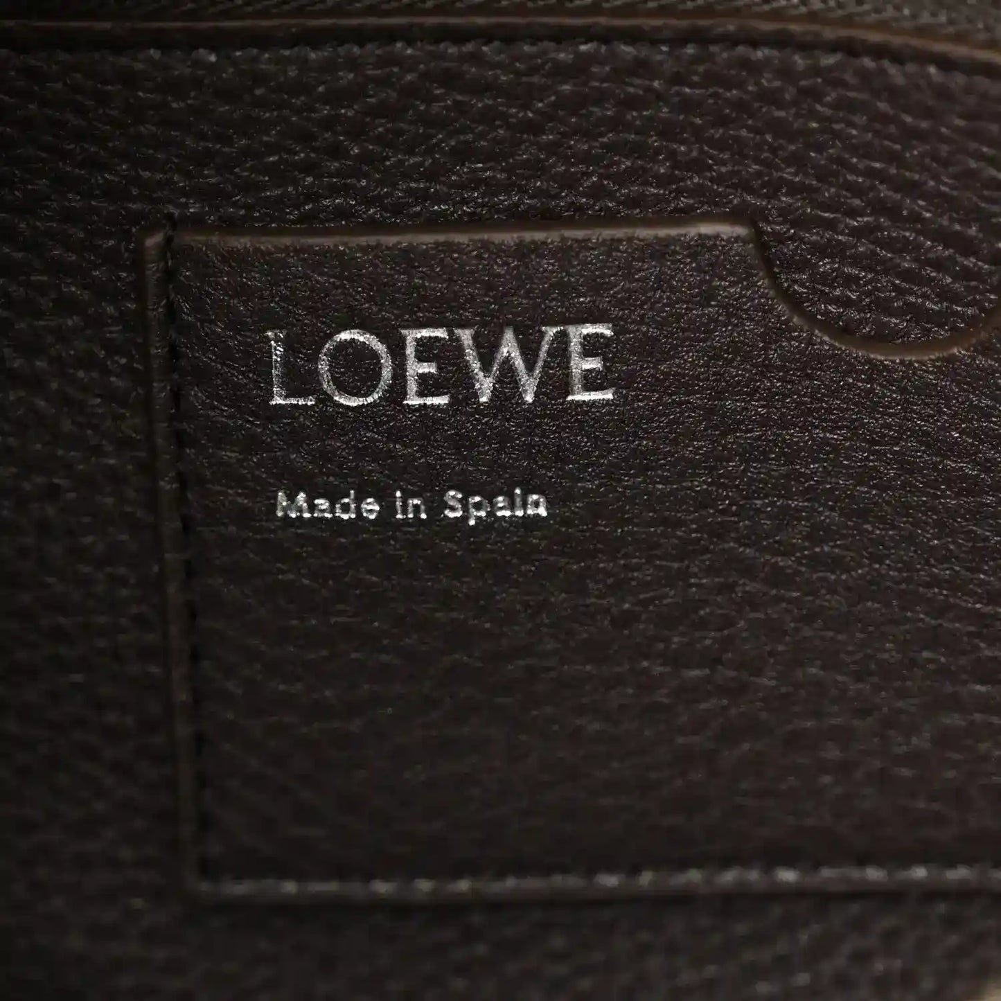 Loewe leather bag label reading 'LOEWE' and 'Made in Spain'