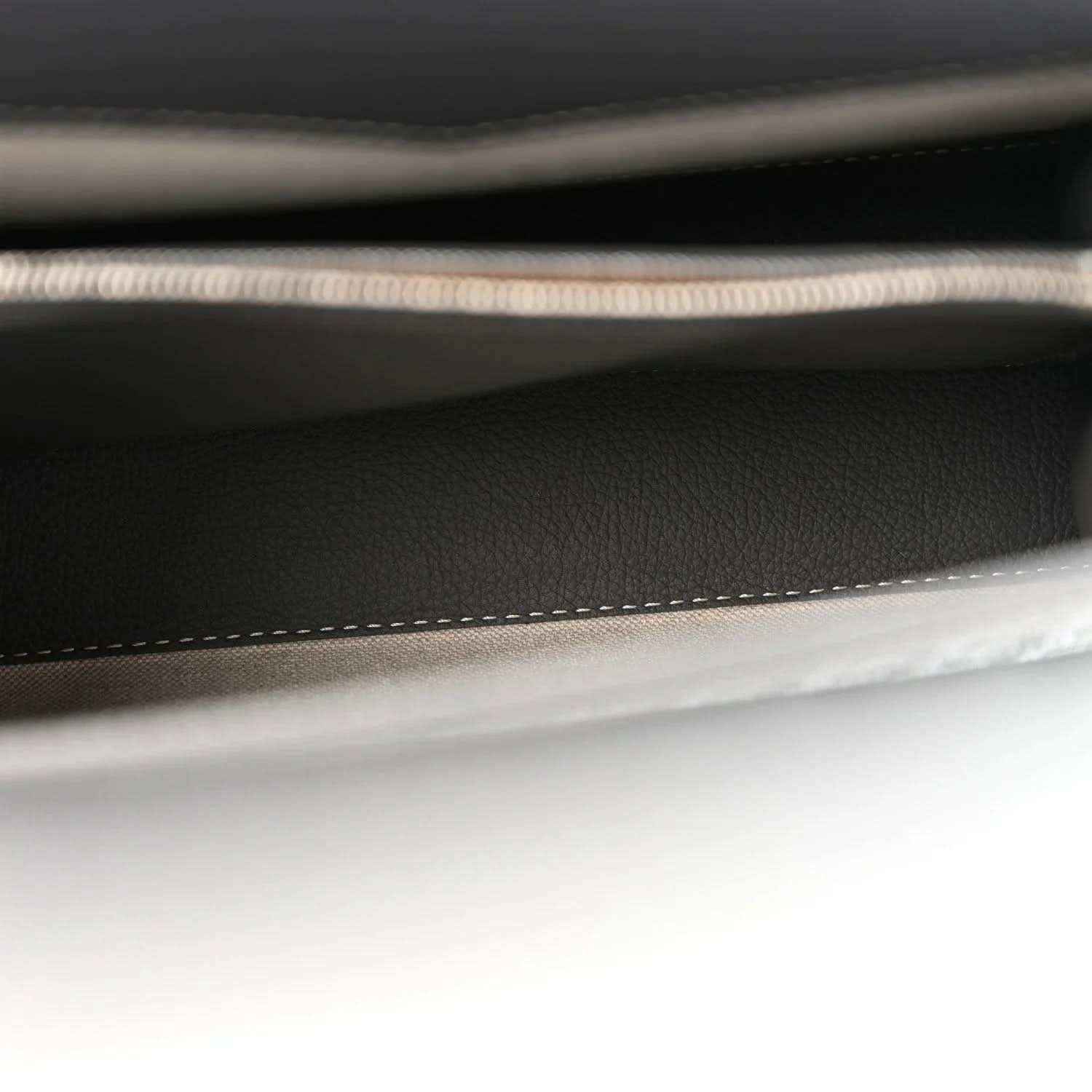 Black interior pocket seam with braided trim and contrast edge stitching