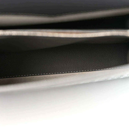 Black interior pocket seam with braided trim and contrast edge stitching