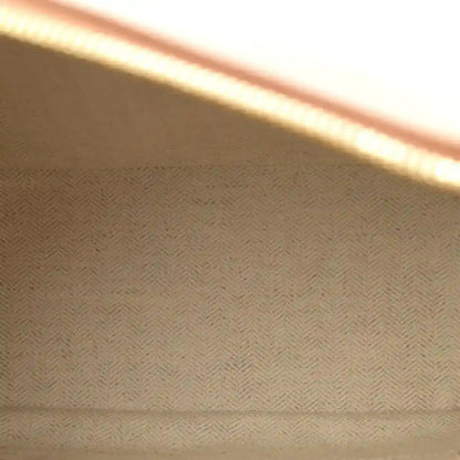 Herringbone fabric lining panel inside the bag