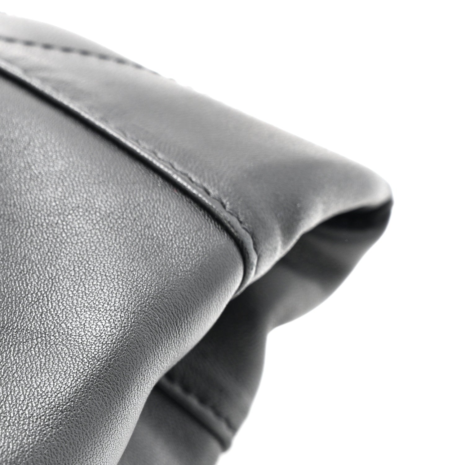 Black leather bag rim with rounded gathered edge and seam detail
