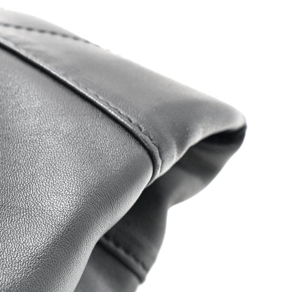 Black leather bag rim with rounded gathered edge and seam detail