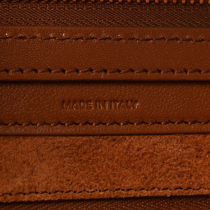 Leather branding and stitching with “MADE IN ITALY” on tan panel