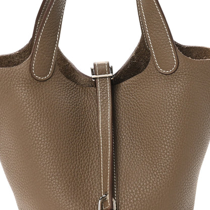 Taupe leather tote bag front with Picotin lock and top handle loops