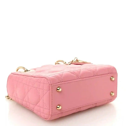 Light pink mini Lady Dior handbag with quilted sides and gold feet studs