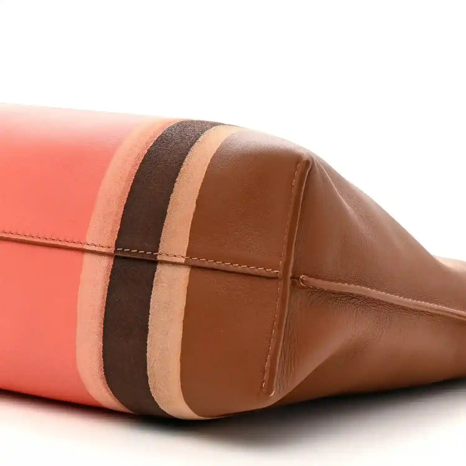 Flamenco knot clutch corner close-up with coral panel and brown striped trim
