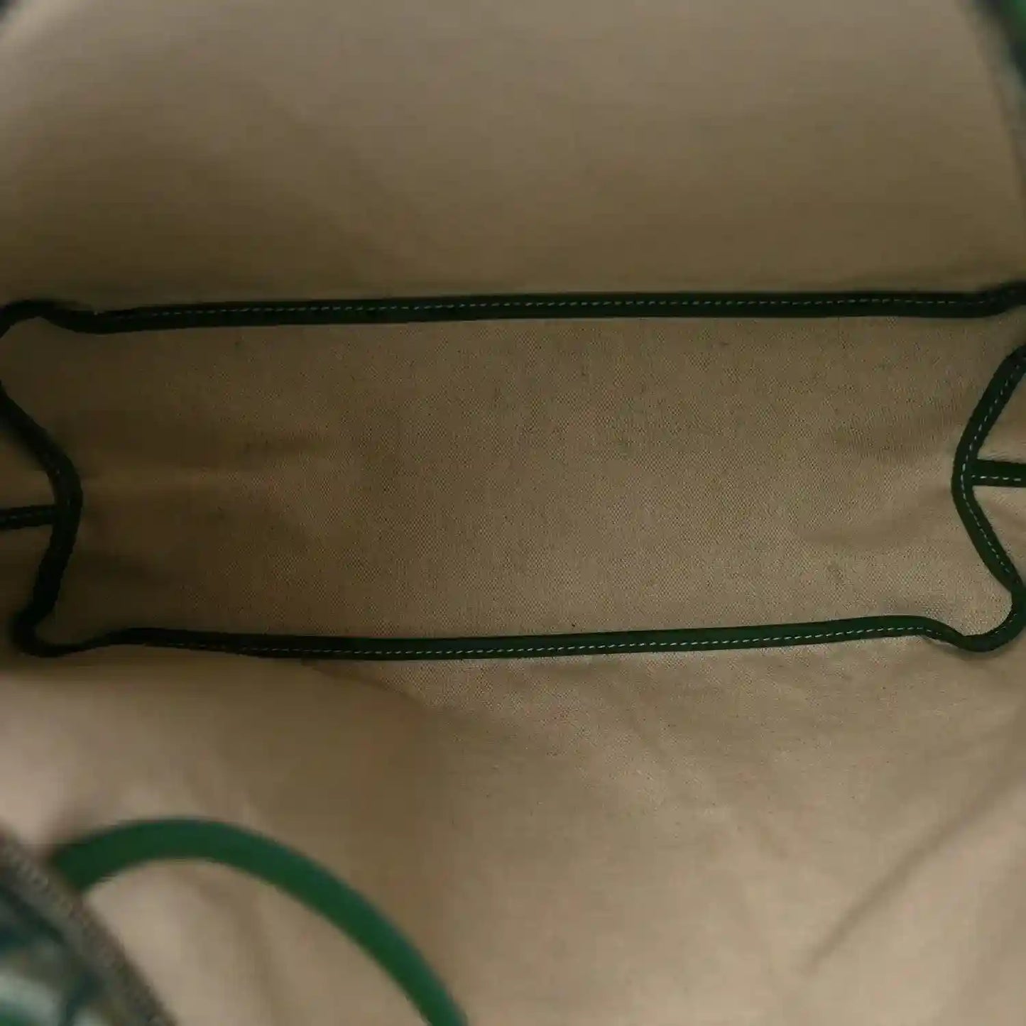 Green interior lining with matching straps and stitched trim