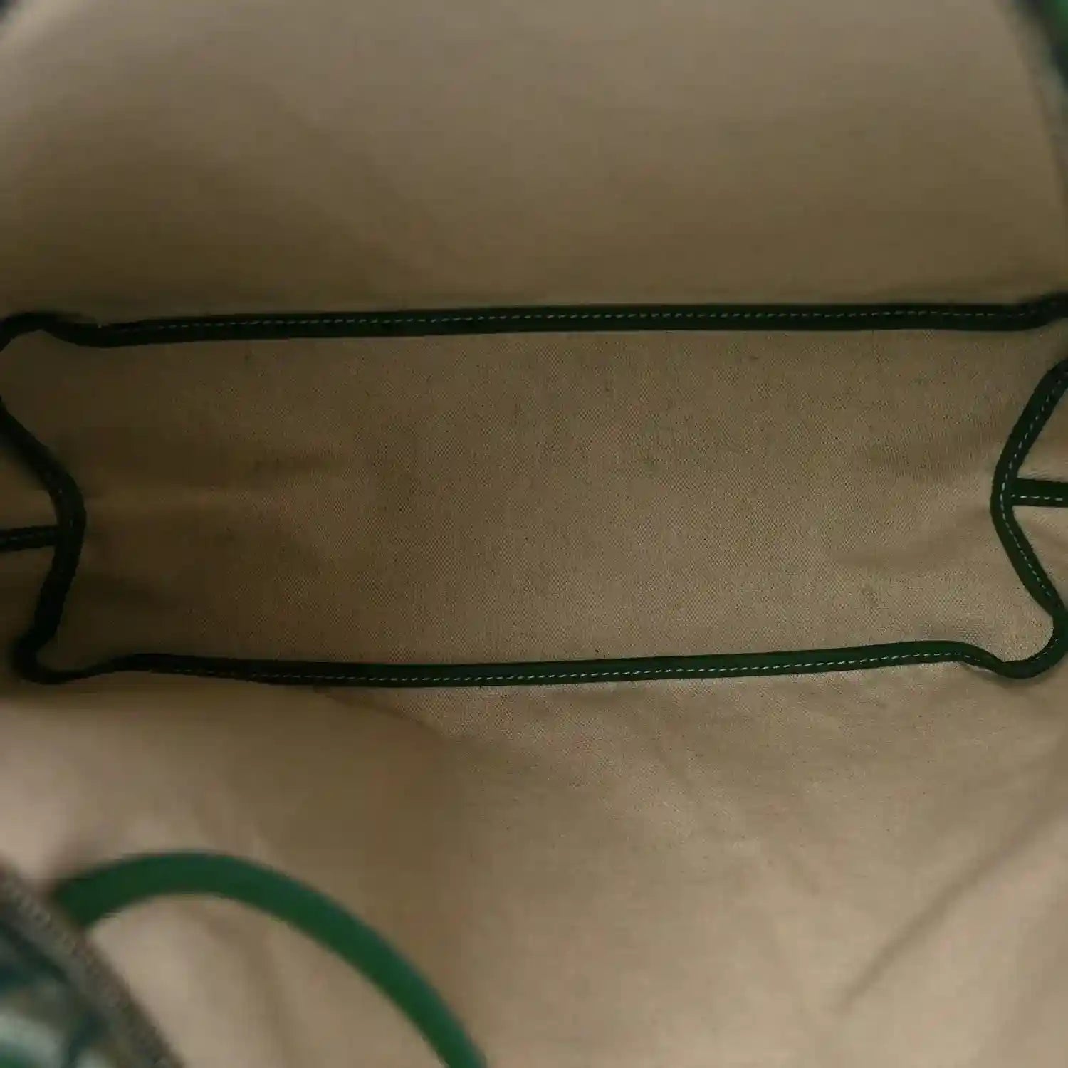 Green interior lining with matching straps and stitched trim