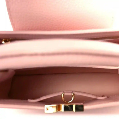 Louis Vuitton Capucines BB shoulder bag interior with pink lining and gold clasp hardware