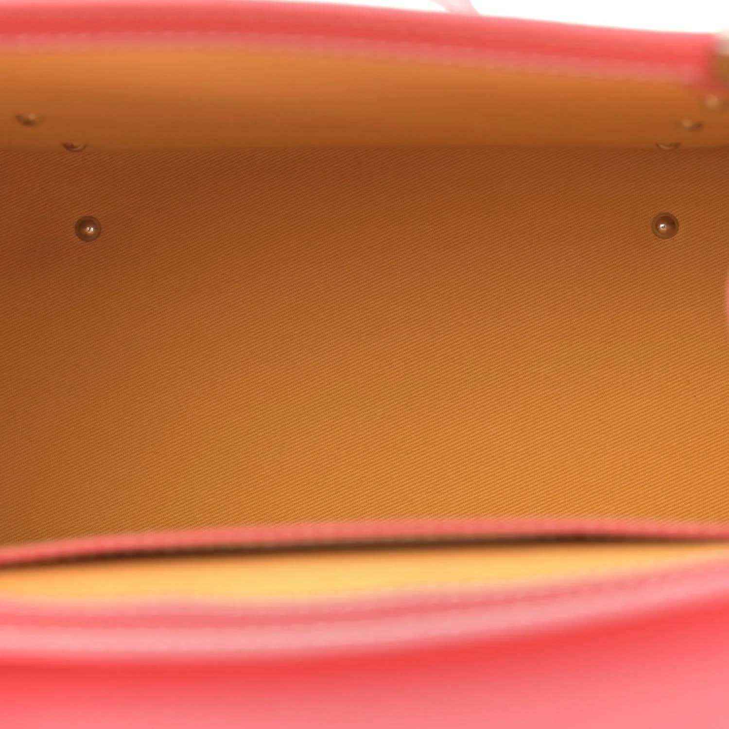 Pink canvas bag base with metal studs and a stitched edge detail.
