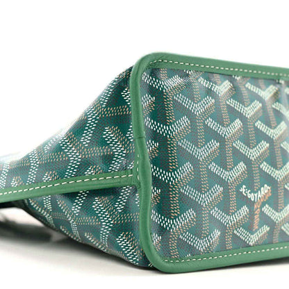 Reversible mini tote bag side panel with green Goyardine pattern and stitched trim