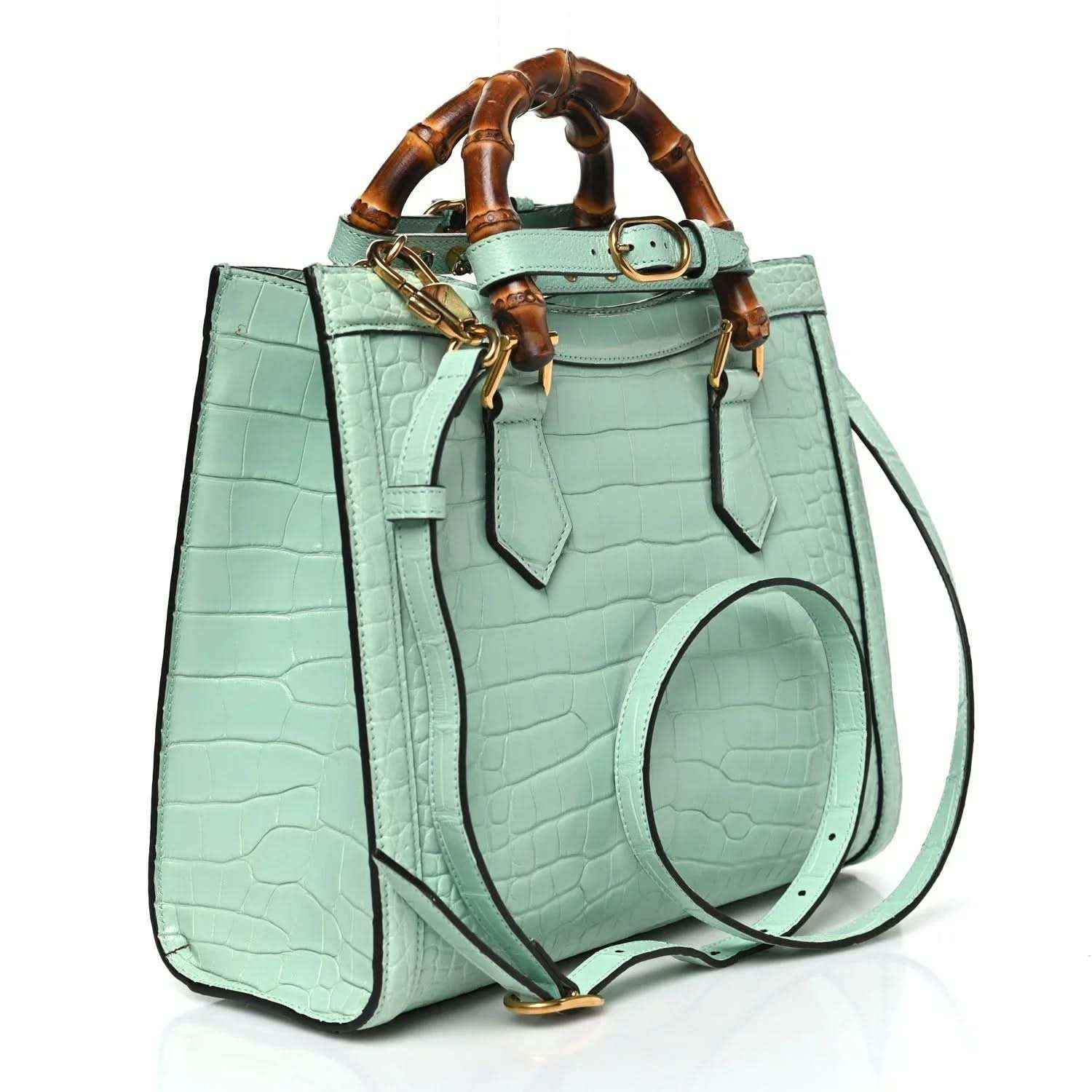 Green alligator-pattern small tote bag with bamboo-style top handles and crossbody strap
