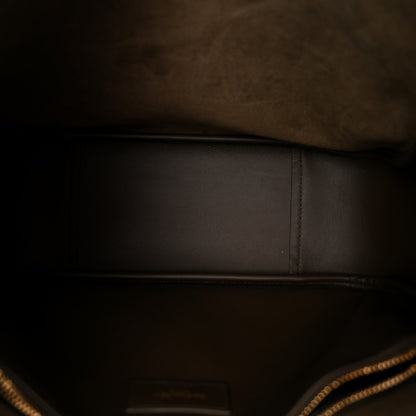 Saint Laurent smooth calfskin hobo bag interior with stitched seam along the base