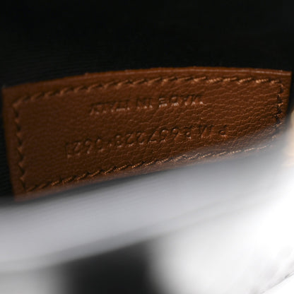 Close-up of tan inside label text on hobo bag lining.