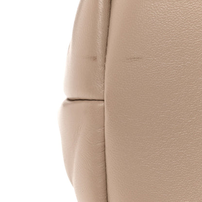 Dark beige quilted lambskin puffer satchel with padded panel stitching