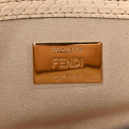 Fendi baguette handbag logo plaque, gold-tone hardware on beige textured leather