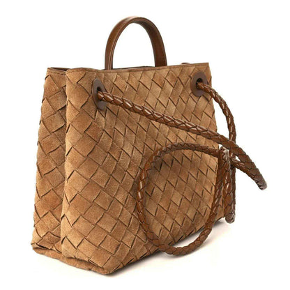 Amber suede intrecciato shoulder bag with gold ring clasp and attached braided strap