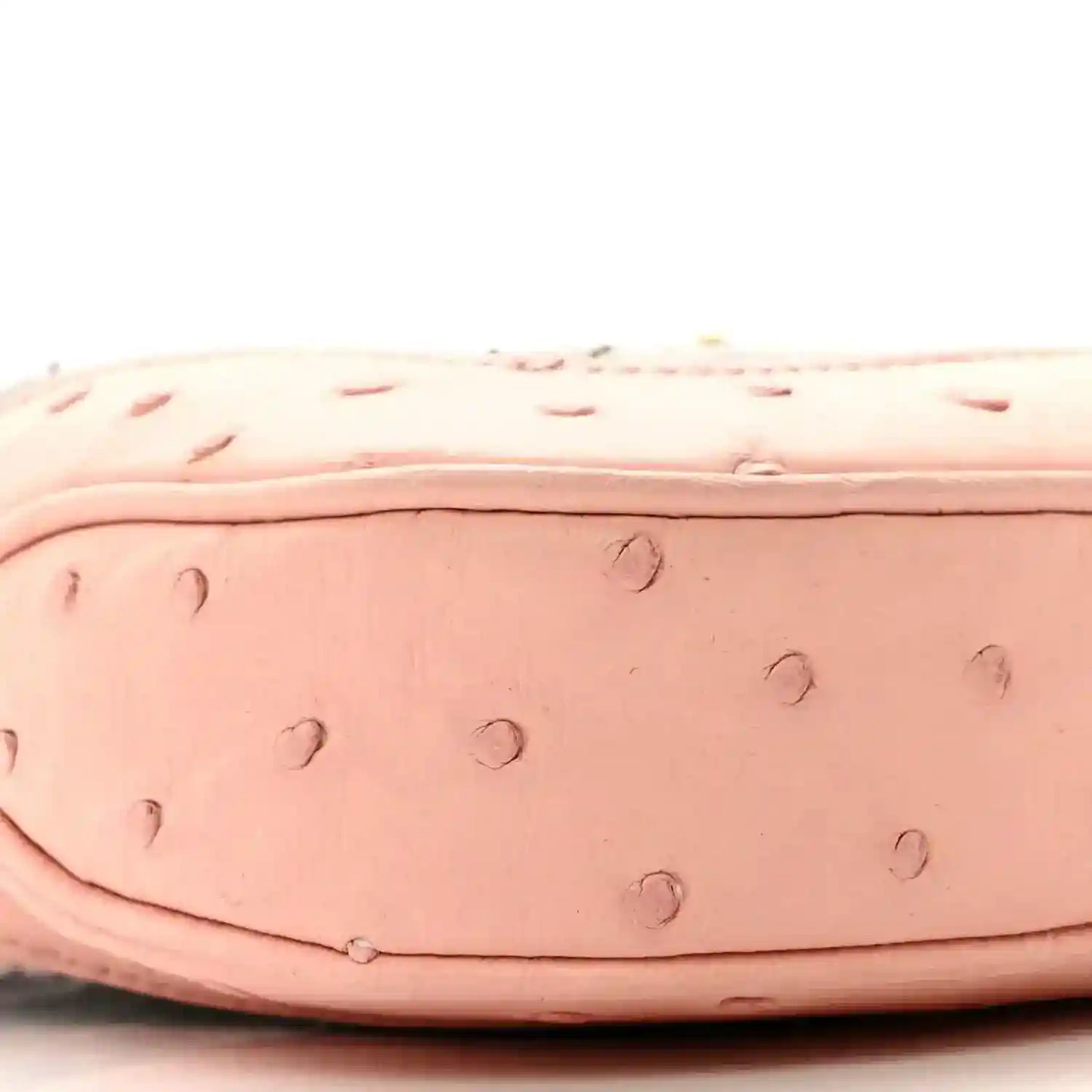 Gucci small hobo bag side close-up of pale pink ostrich-style texture