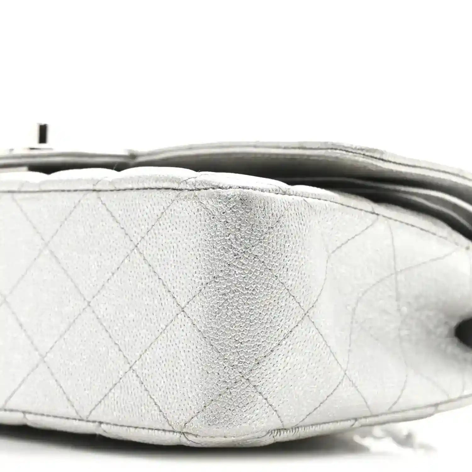 Chanel silver metallic double flap bag underside edge close-up with quilting seams