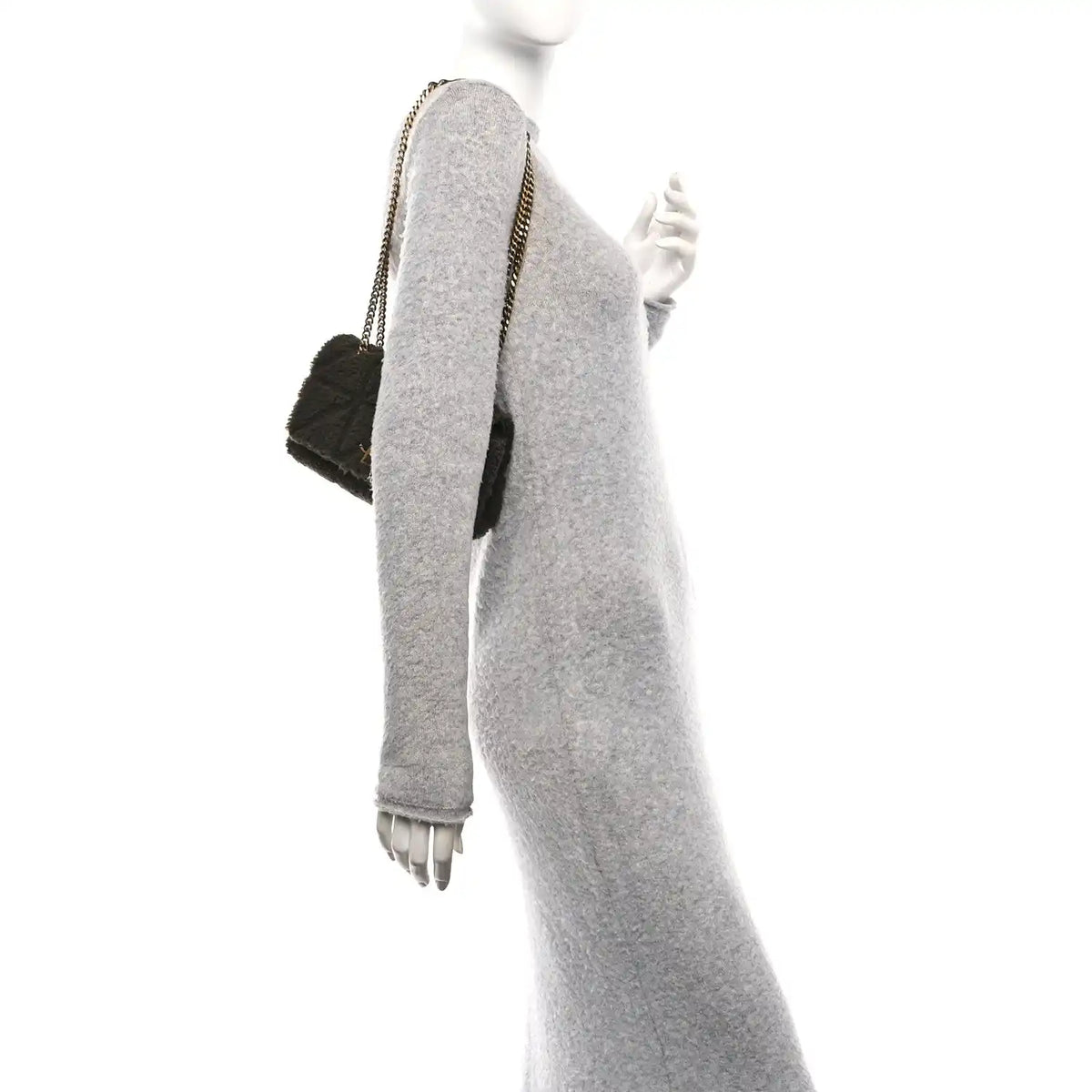 Dark shearling shoulder bag with gold chain strap, side profile