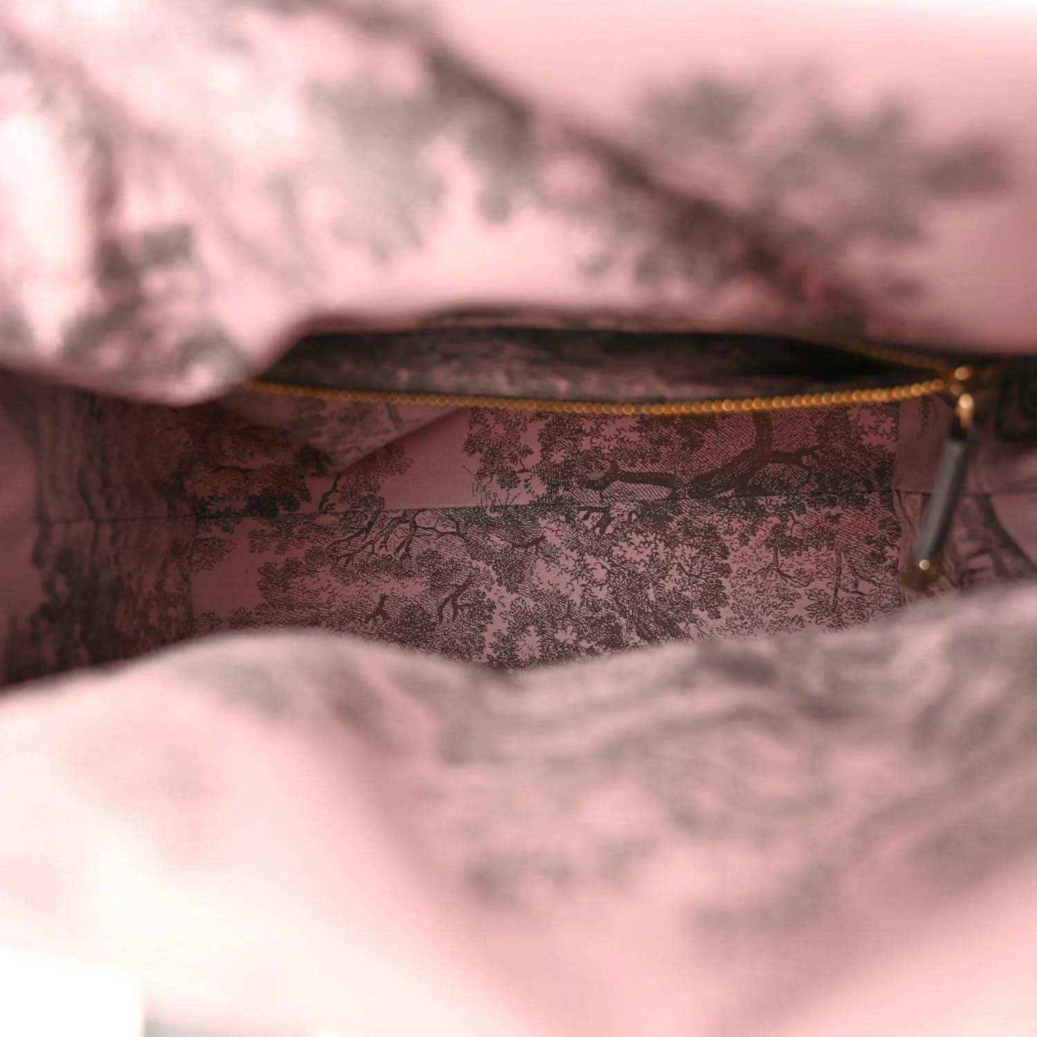 Medium wicker bag interior with pink patterned lining and zip top edge