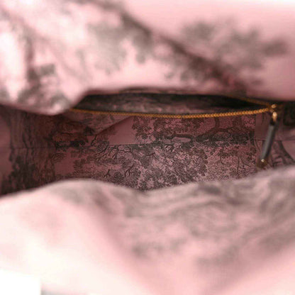 Medium wicker bag interior with pink patterned lining and zip top edge