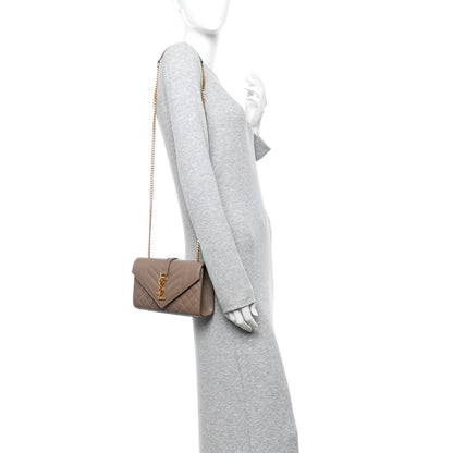 Dark beige quilted satchel with short leather strap and gold chain strap