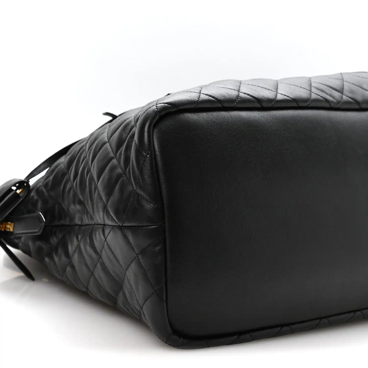 Black quilted leather travel bag with smooth end panel and shoulder strap