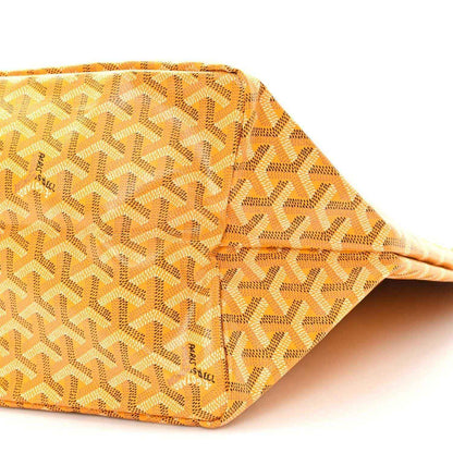 Yellow canvas tote bag side panel with Goyardine pattern and orange piping