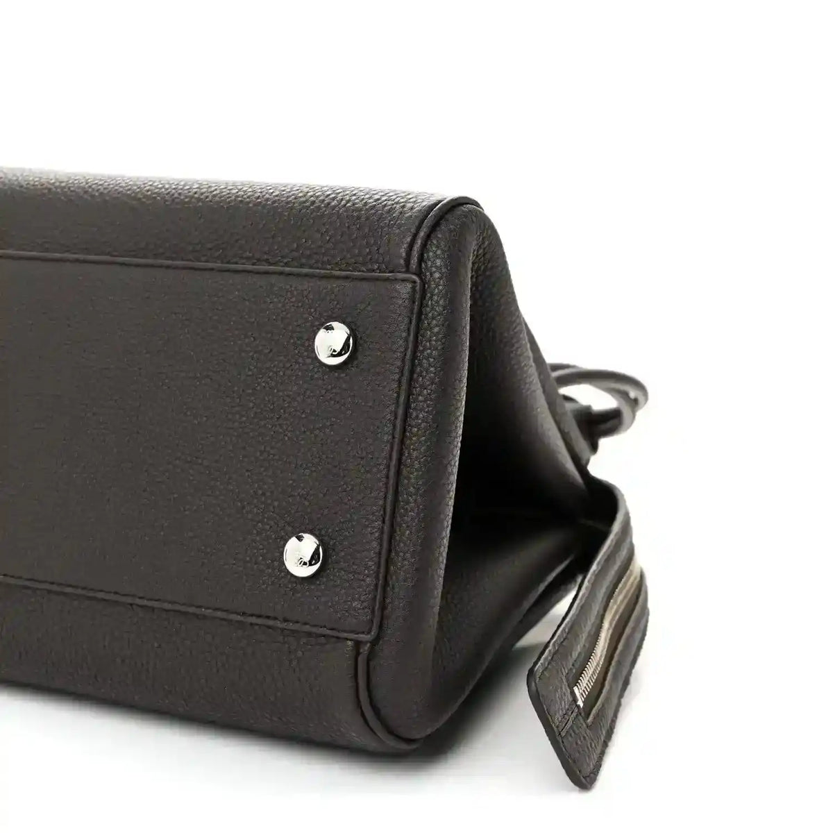 Dark leather Loewe Madrid bag side with silver studs and adjustable strap