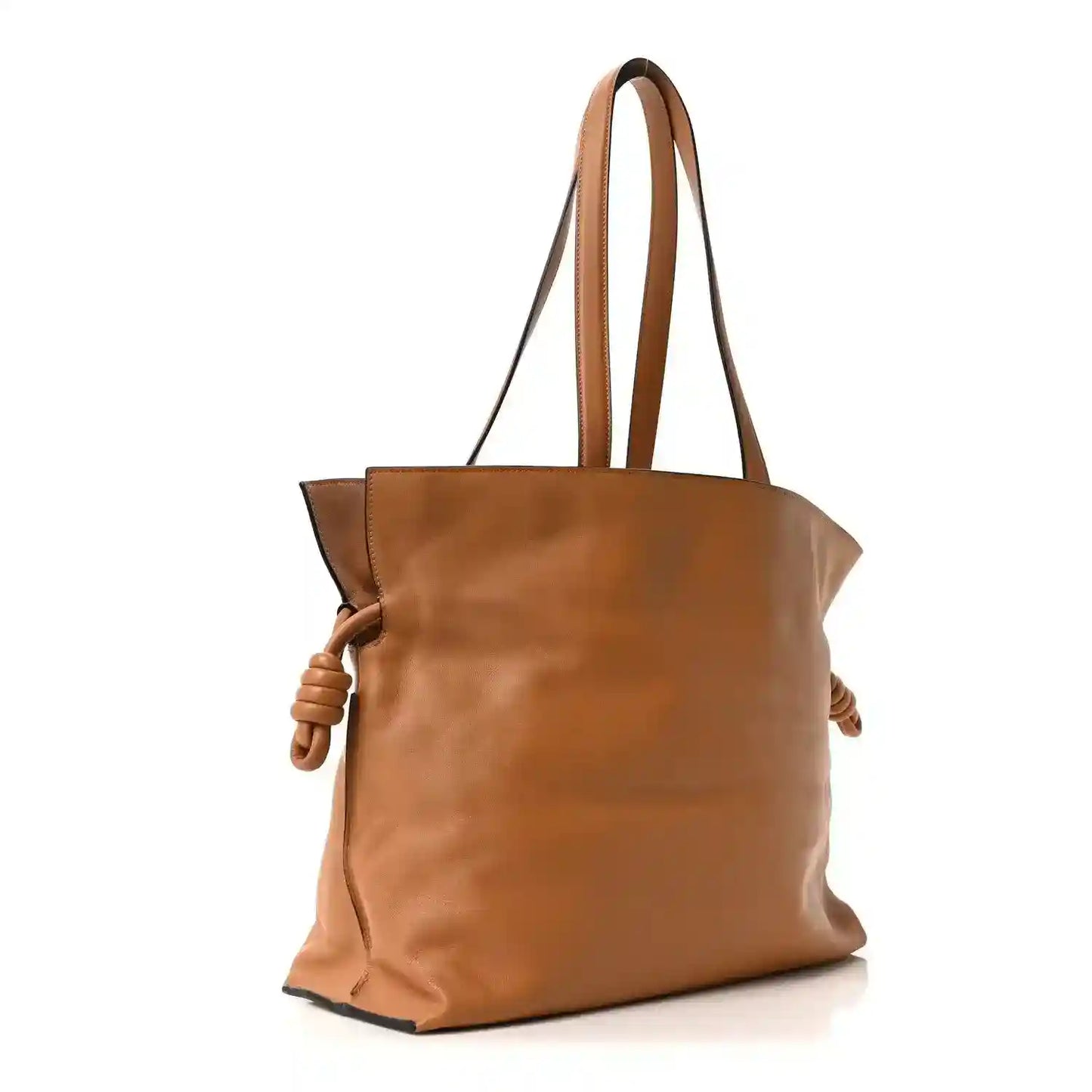 Loewe large Flamenco knot bag, structured warm tan leather with braided side tie accents.