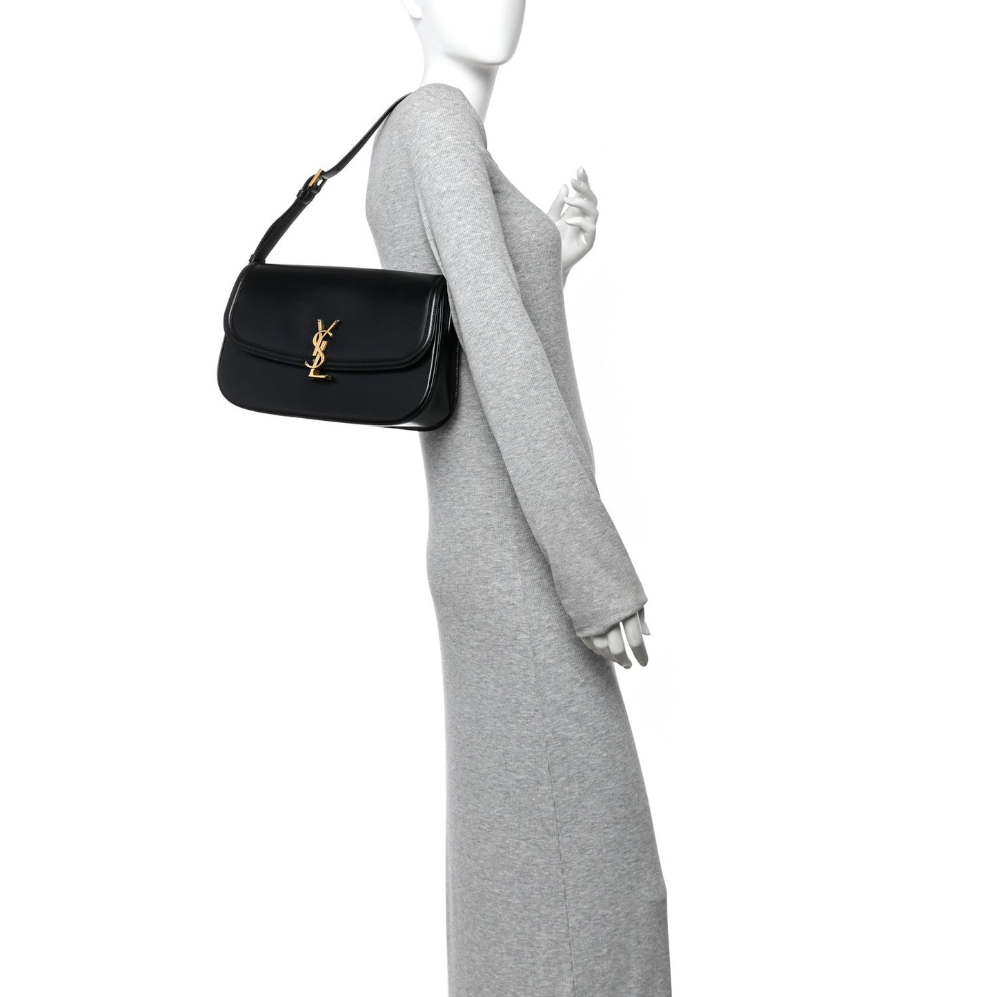 Saint Laurent black leather shoulder bag with gold YSL monogram on a model