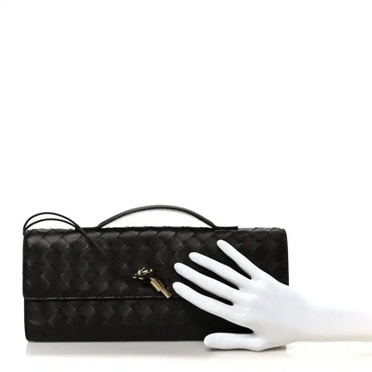 Bottega Veneta Intrecciato leather clutch with top handle, dark finish, gold clasp detail