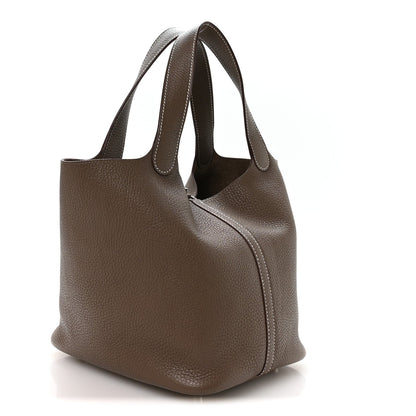 Taupe leather handbag with wide top handles and side seam detailing