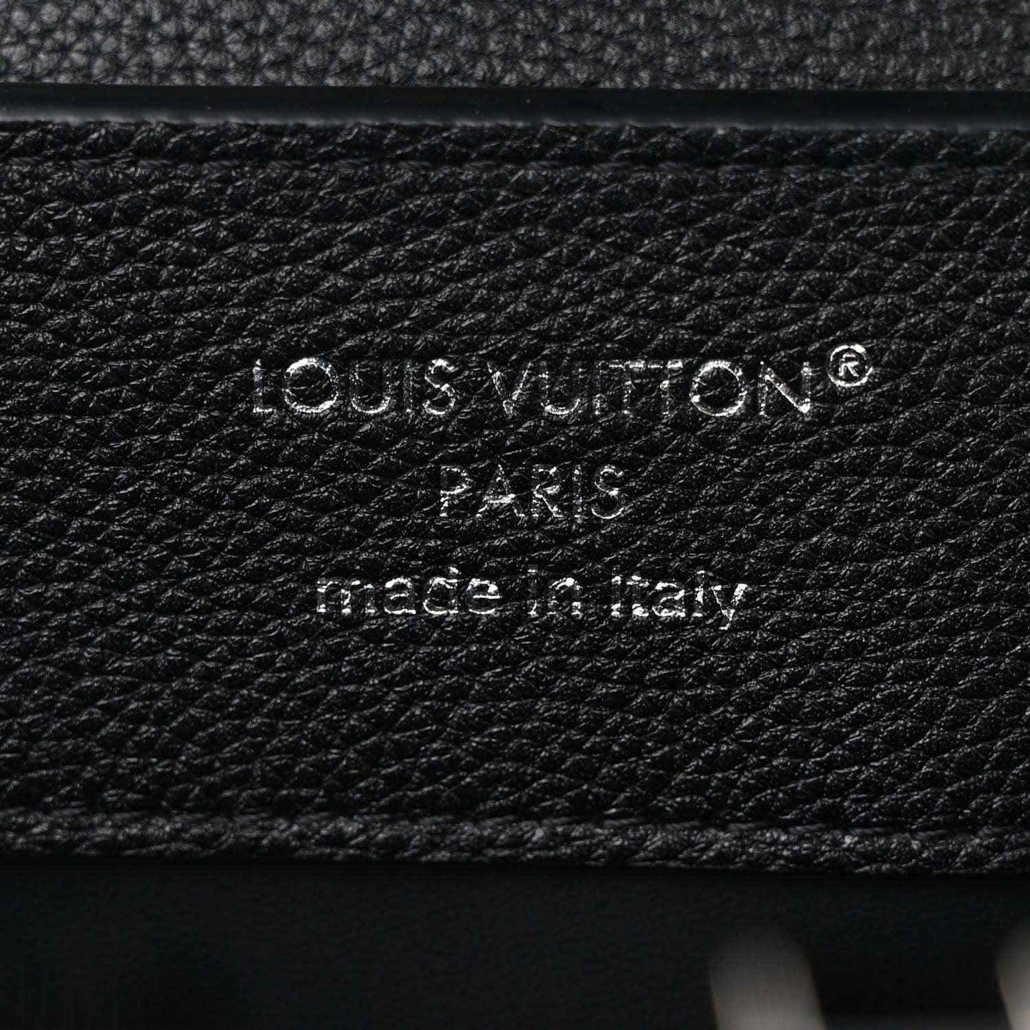 Black leather handbag with embossed Louis Vuitton Paris stamp and made in Italy text