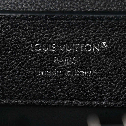 Black leather handbag with embossed Louis Vuitton Paris stamp and made in Italy text