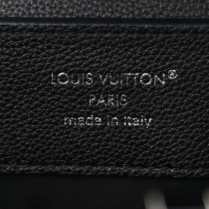 Black leather handbag with embossed Louis Vuitton Paris stamp and made in Italy text