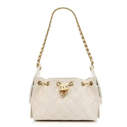 White quilted leather mini handbag with gold-tone chain strap and turn-lock closure