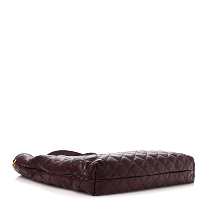 Quilted lambskin tote with flat base and single front zip pocket