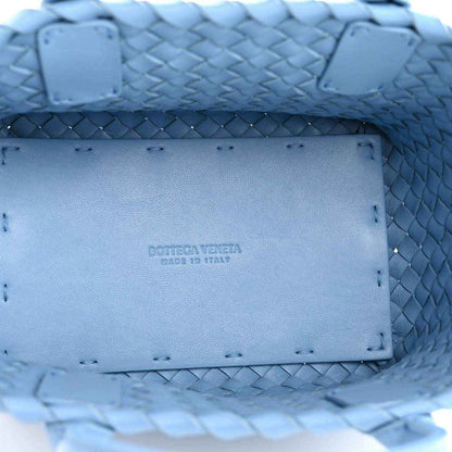 Blue interior leather patch with Bottega Veneta logo on woven mini cabat tote