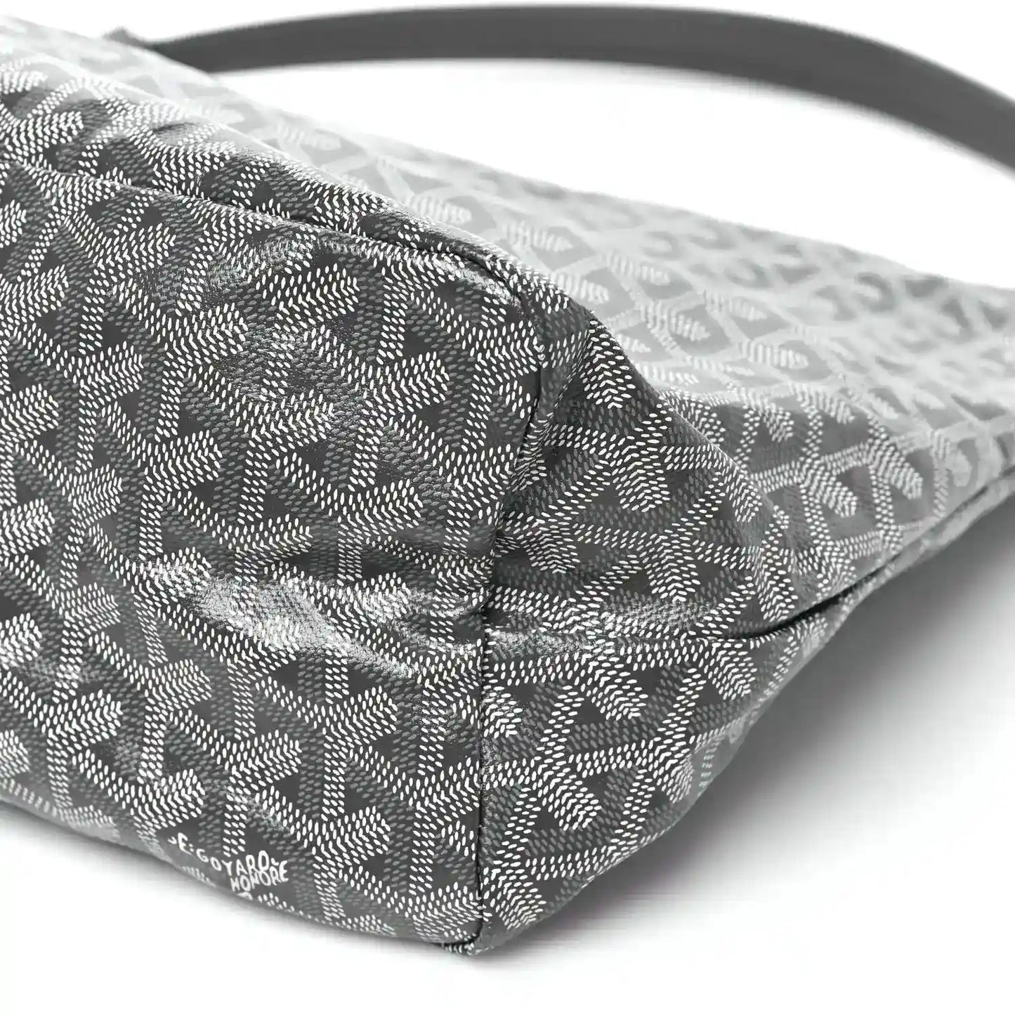 Grey coated canvas hobo bag base corner with repeating pattern and stitching