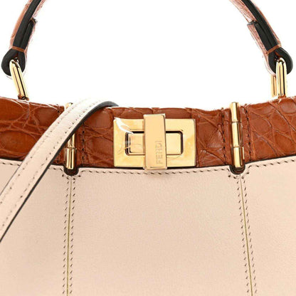 Mini Peekaboo satchel top handle with gold clasp and brown crocodile-pattern trim